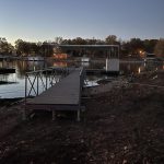 Custom boat dock walkway and covered lift structure on Grand Lake at dusk in Grand Lake Oklahoma