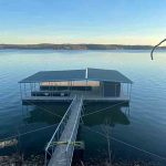 Covered floating boat dock with central gangway on Grand Lake in Grand Lake, Oklahoma