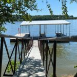 Covered boat dock walkway leading to twin slips on Grand Lake in Grand Lake Oklahoma