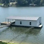 Covered floating boat dock with lift system on Grand Lake in Grand Lake, Oklahoma