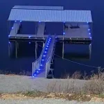 Covered multi slip boat dock with blue LED lit stairs on Grand Lake in Grand Lake Oklahoma